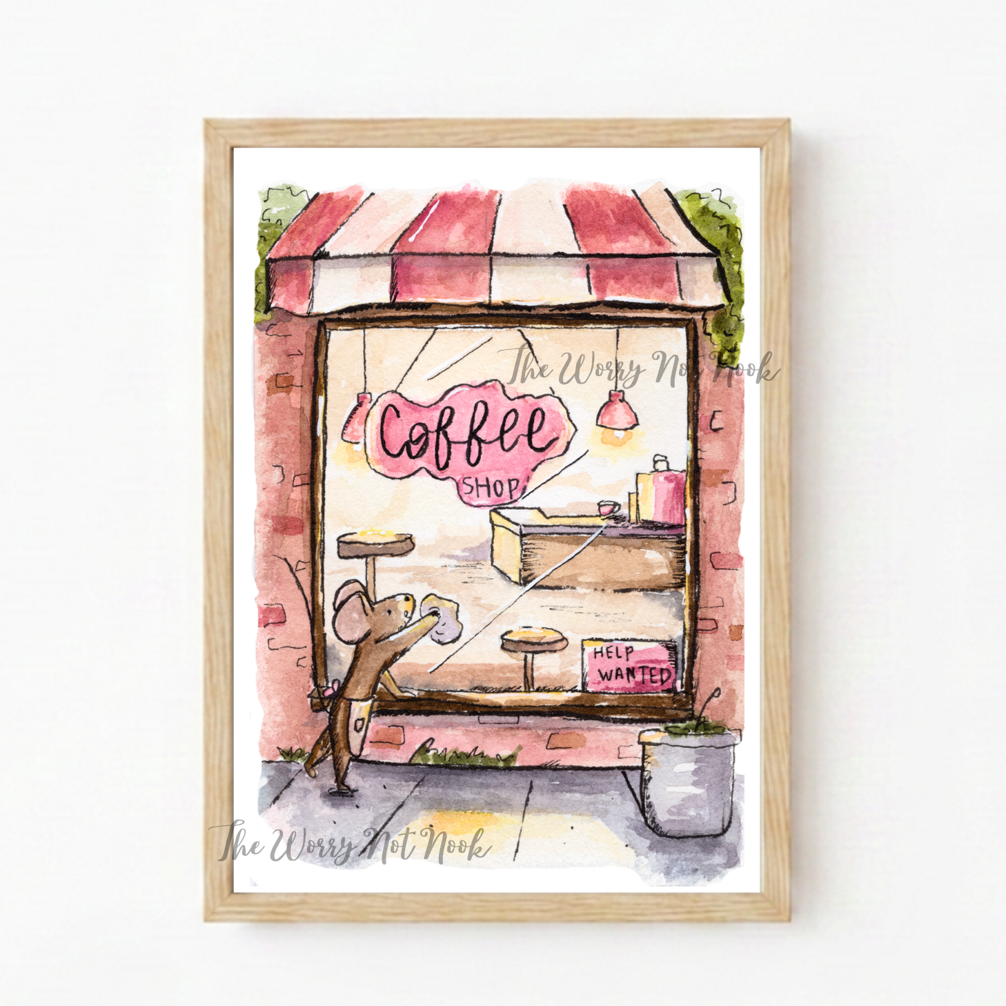 Framed artwork of a coffee shop with a striped awning and a mouse on a white background